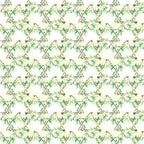A repeating geometric pattern with green and beige floral designs forming diamond shapes.
