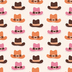 Pattern of brown, orange, and pink cowboy hats with belts on a light background.