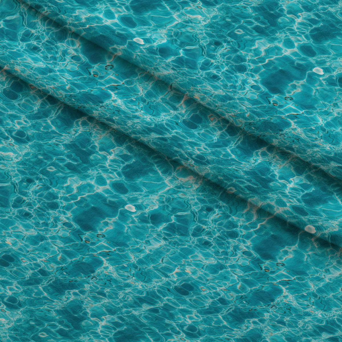 Aqua Currents Pattern 7 Fleece Fabric — fleece fabric folded close-up preview (mv-fleece-v1:lying)