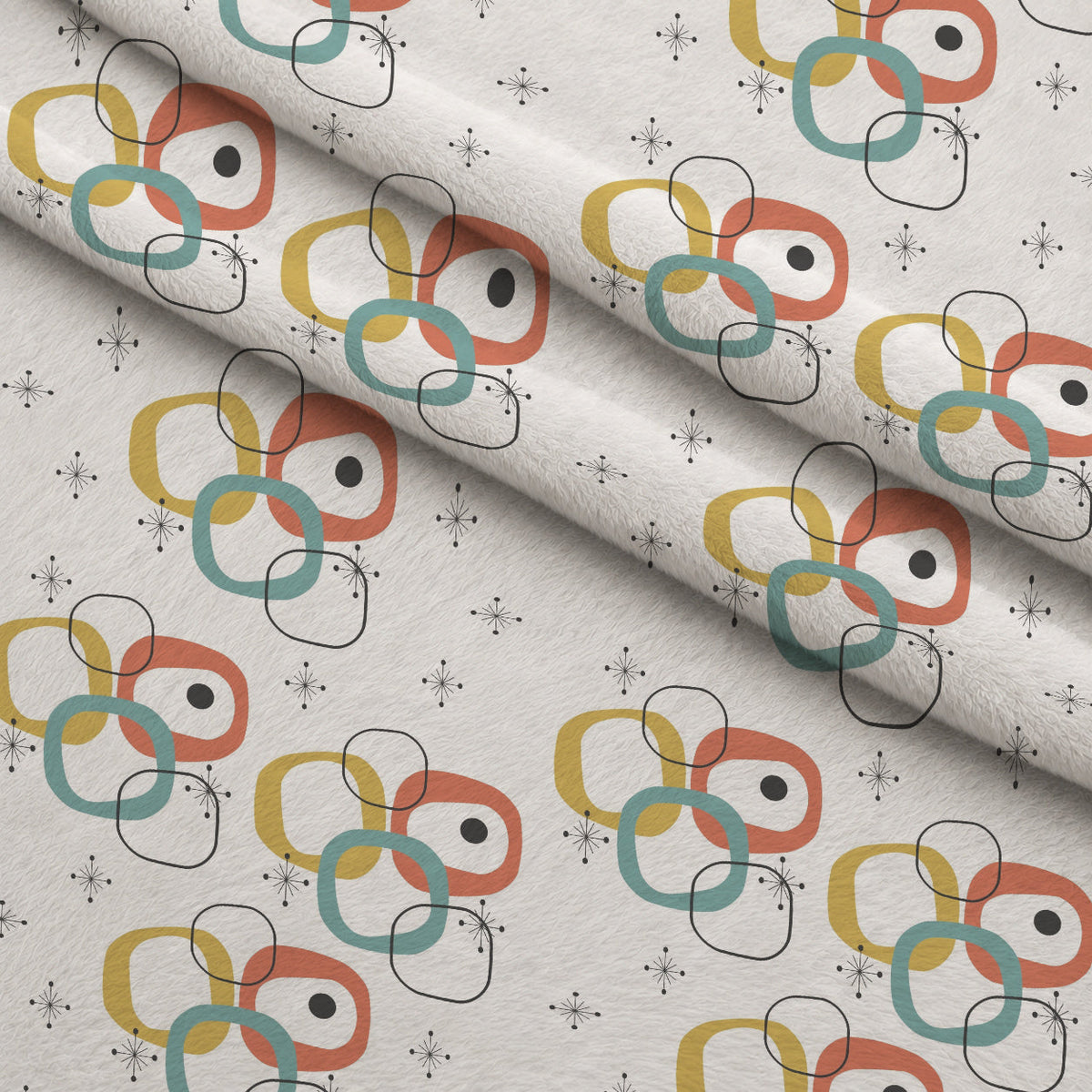Atomic Lounge Pattern 16 Fleece Fabric — fleece fabric folded close-up preview (mv-fleece-v1:lying)