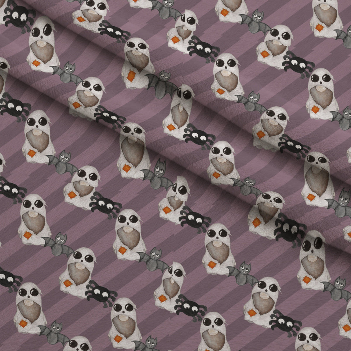 Bewitched Buddies Pattern 10 Fleece Fabric — fleece fabric folded close-up preview (mv-fleece-v1:lying)