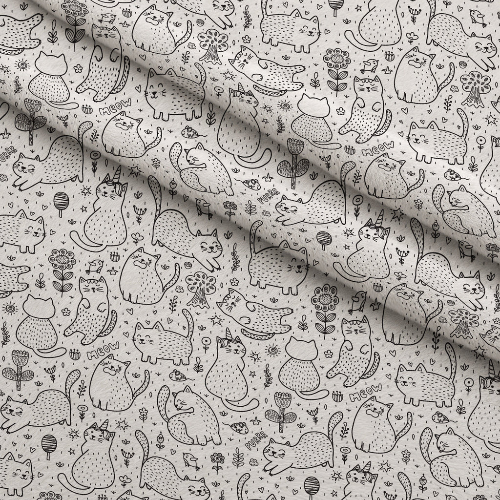 Black and White Cat Doodles Fleece Fabric — fleece fabric folded close-up preview (mv-fleece-v1:lying)