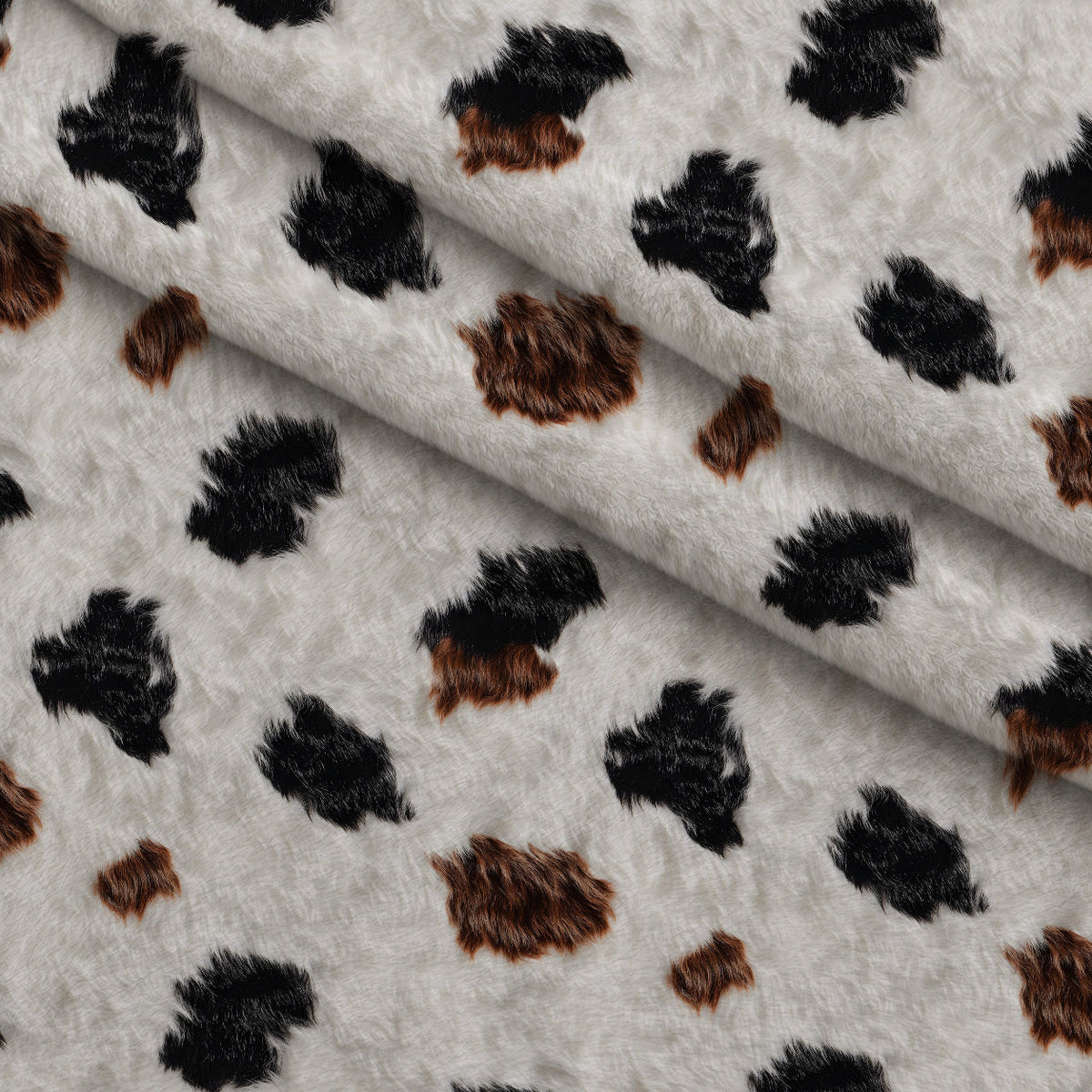 Calico Patches Pattern 16 Fleece Fabric — fleece fabric folded close-up preview (mv-fleece-v1:lying)