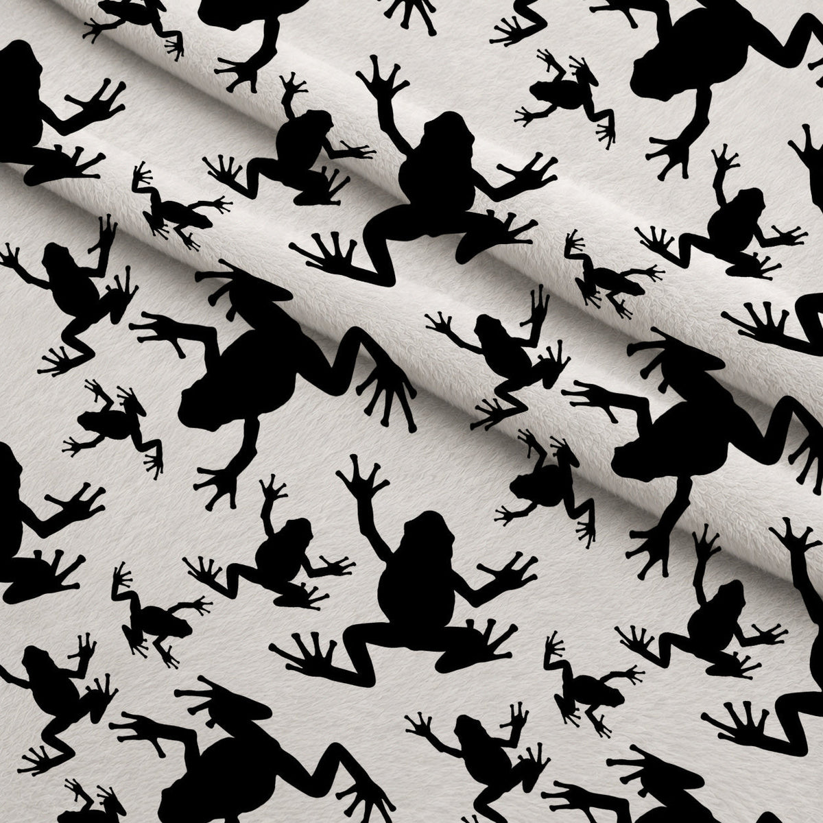 Frog Silhouettes on White Fleece Fabric — fleece fabric folded close-up preview (mv-fleece-v1:lying)