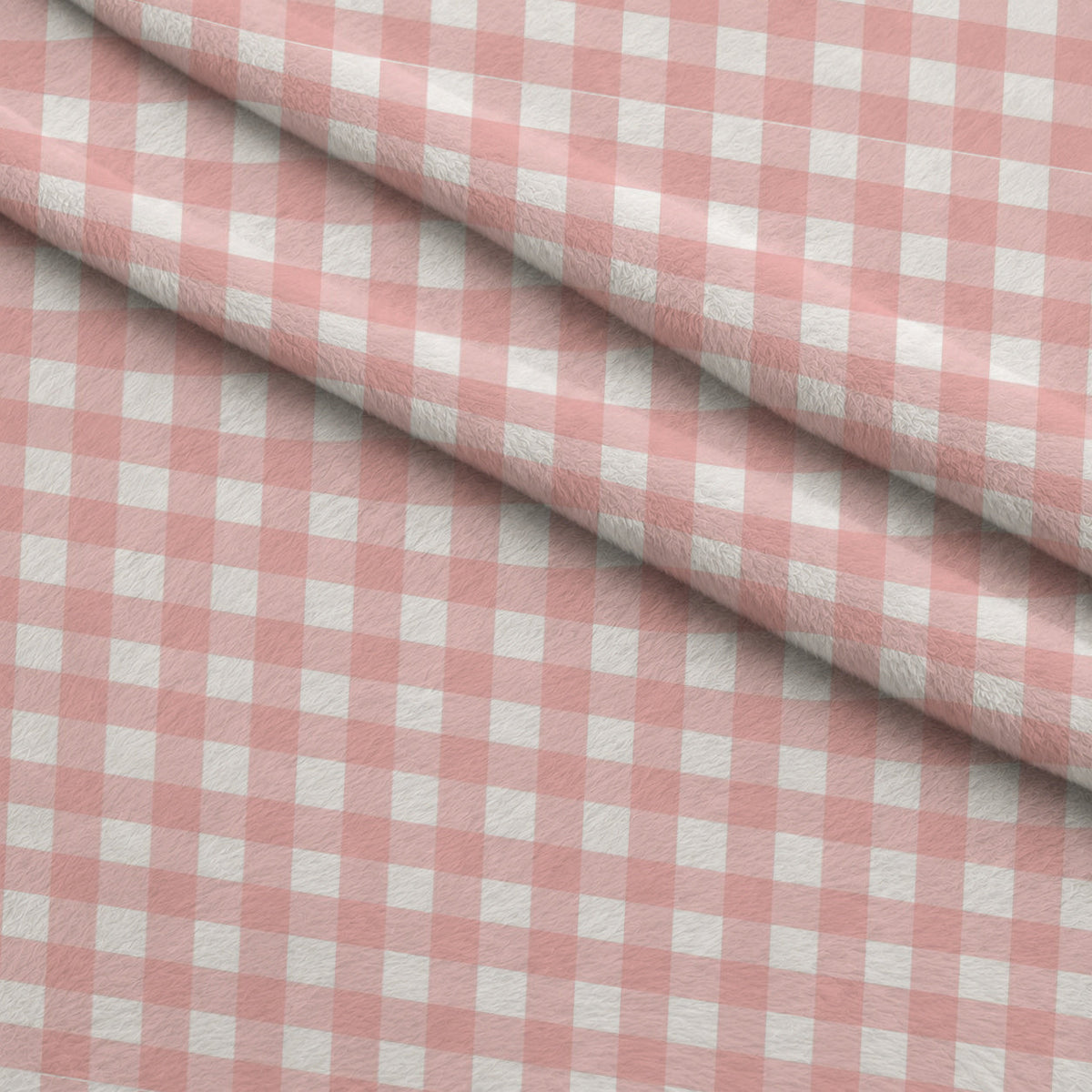Gingham Peach Puff Fleece Fabric — fleece fabric folded close-up preview (mv-fleece-v1:lying)