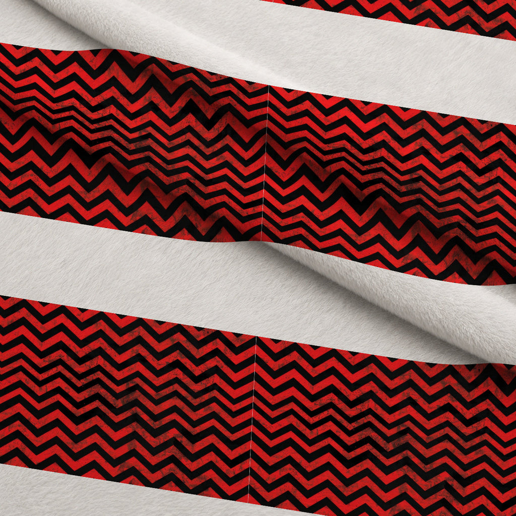 Grunge Red and Black Chevron Pattern Fleece Fabric — fleece fabric folded close-up preview (mv-fleece-v1:lying)