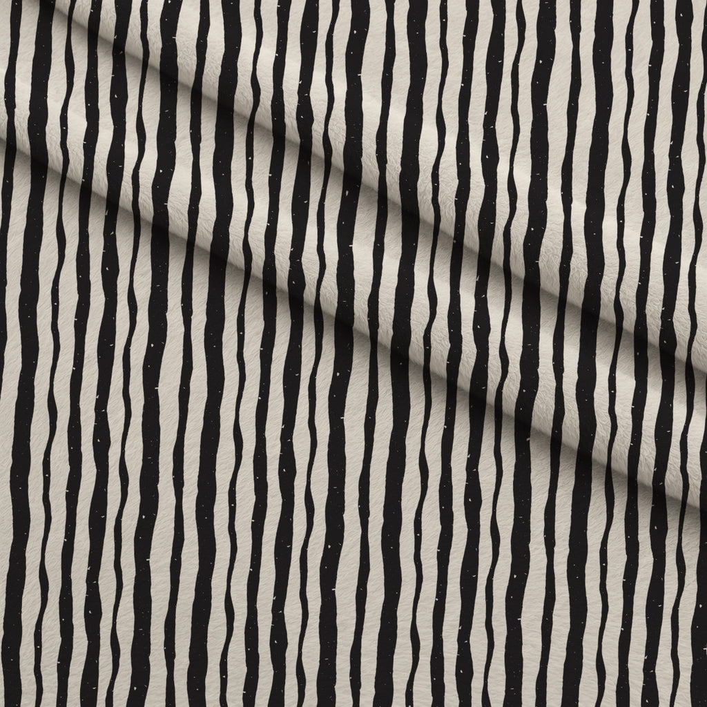 Ink Block Print Pattern 9 Fleece Fabric — fleece fabric folded close-up preview (mv-fleece-v1:lying)