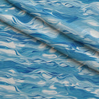Liquid Sapphire Pattern 4 Fleece Fabric — fleece fabric folded close-up preview (mv-fleece-v1:lying)