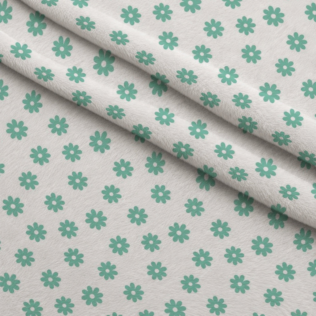 Mint Daisies Fleece Fabric — fleece fabric folded close-up preview (mv-fleece-v1:lying)