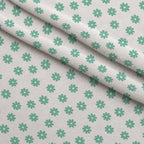 Mint Daisies Fleece Fabric — fleece fabric folded close-up preview (mv-fleece-v1:lying)