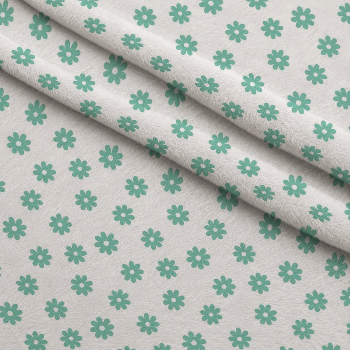 Mint Daisies Fleece Fabric — fleece fabric folded close-up preview (mv-fleece-v1:lying)