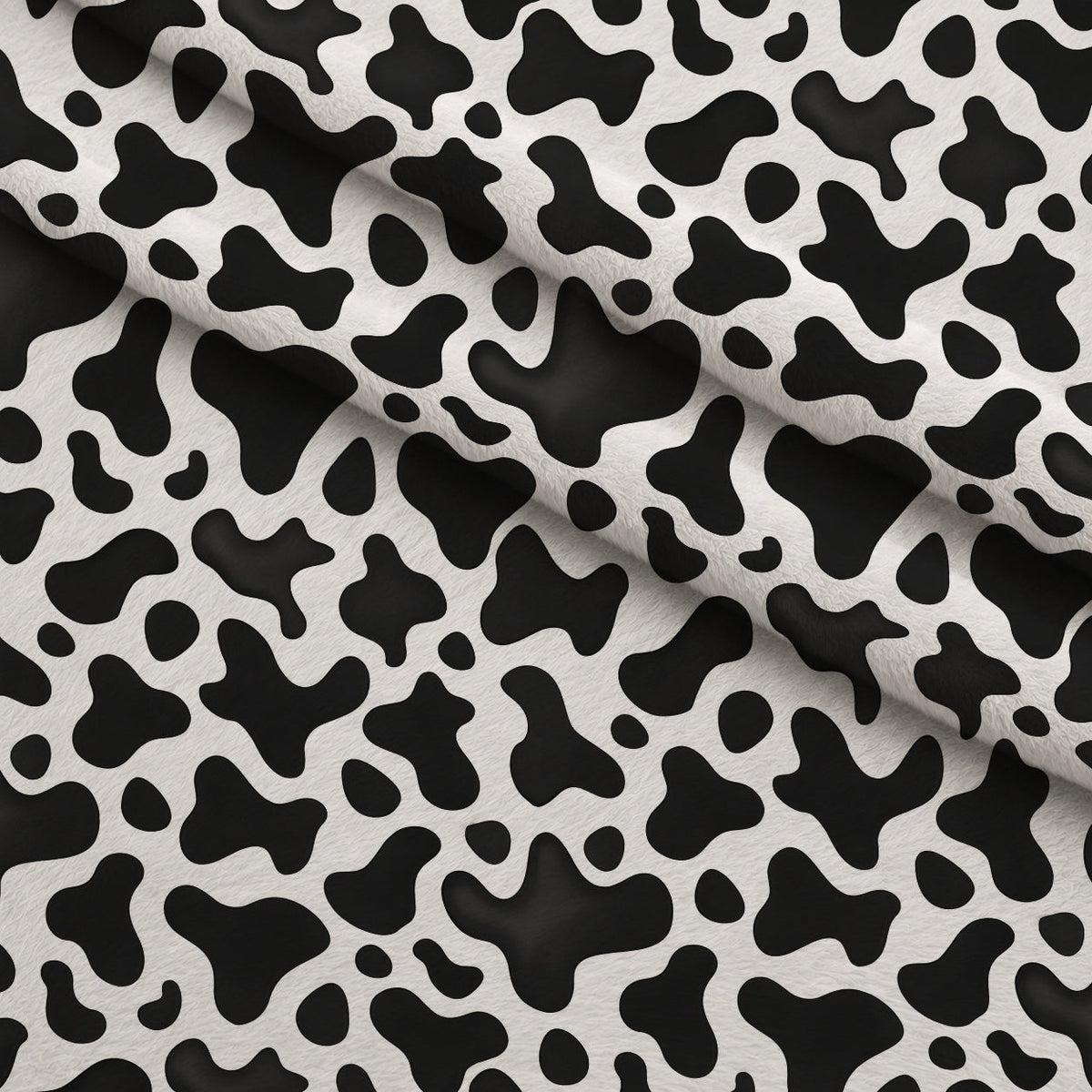 Moo Spots Pattern 3 Fleece Fabric — fleece fabric folded close-up preview (mv-fleece-v1:lying)