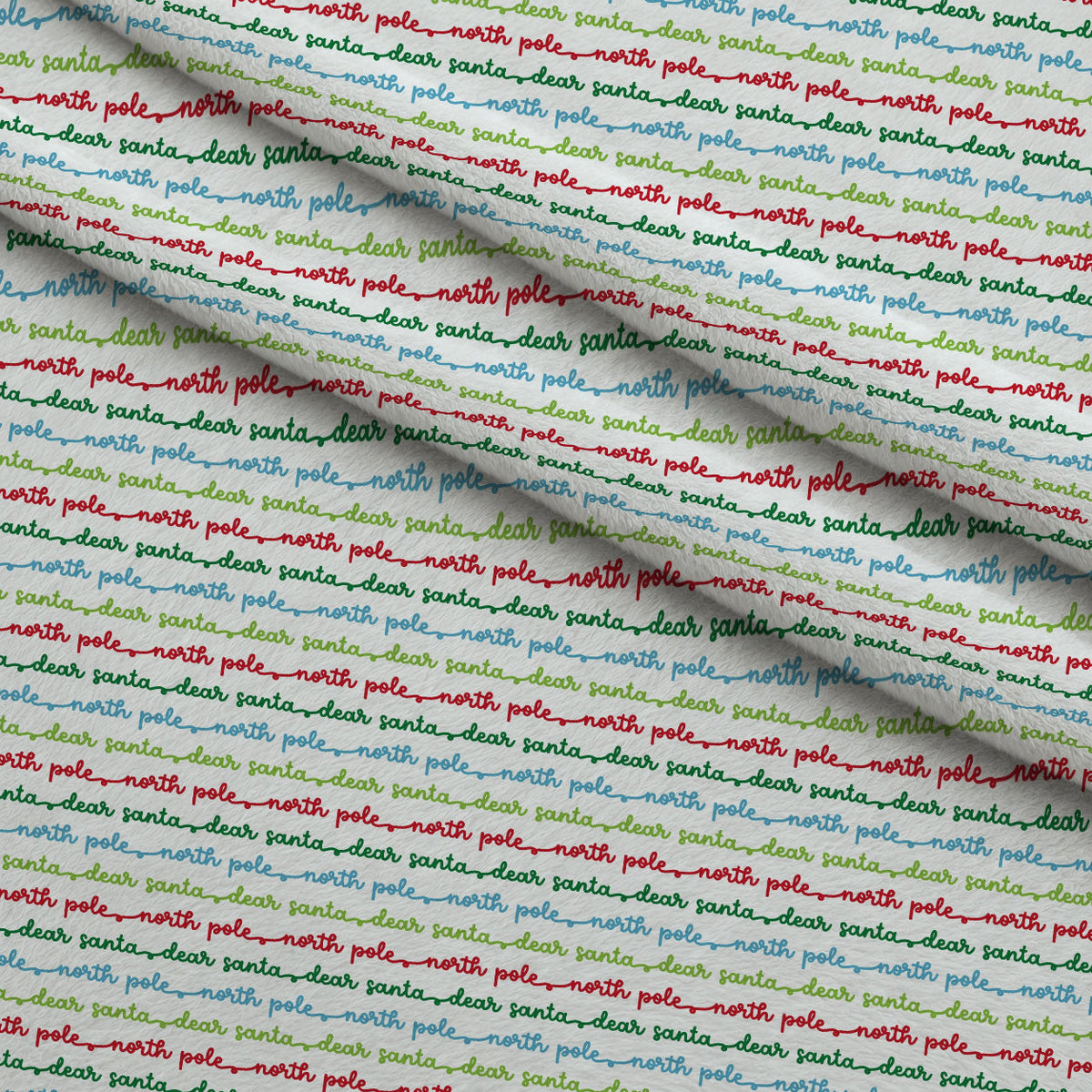 North Pole Post Pattern 8 Fleece Fabric — fleece fabric folded close-up preview (mv-fleece-v1:lying)