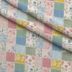 Patchwork Posies Pattern 24 Fleece Fabric — fleece fabric folded close-up preview (mv-fleece-v1:lying)
