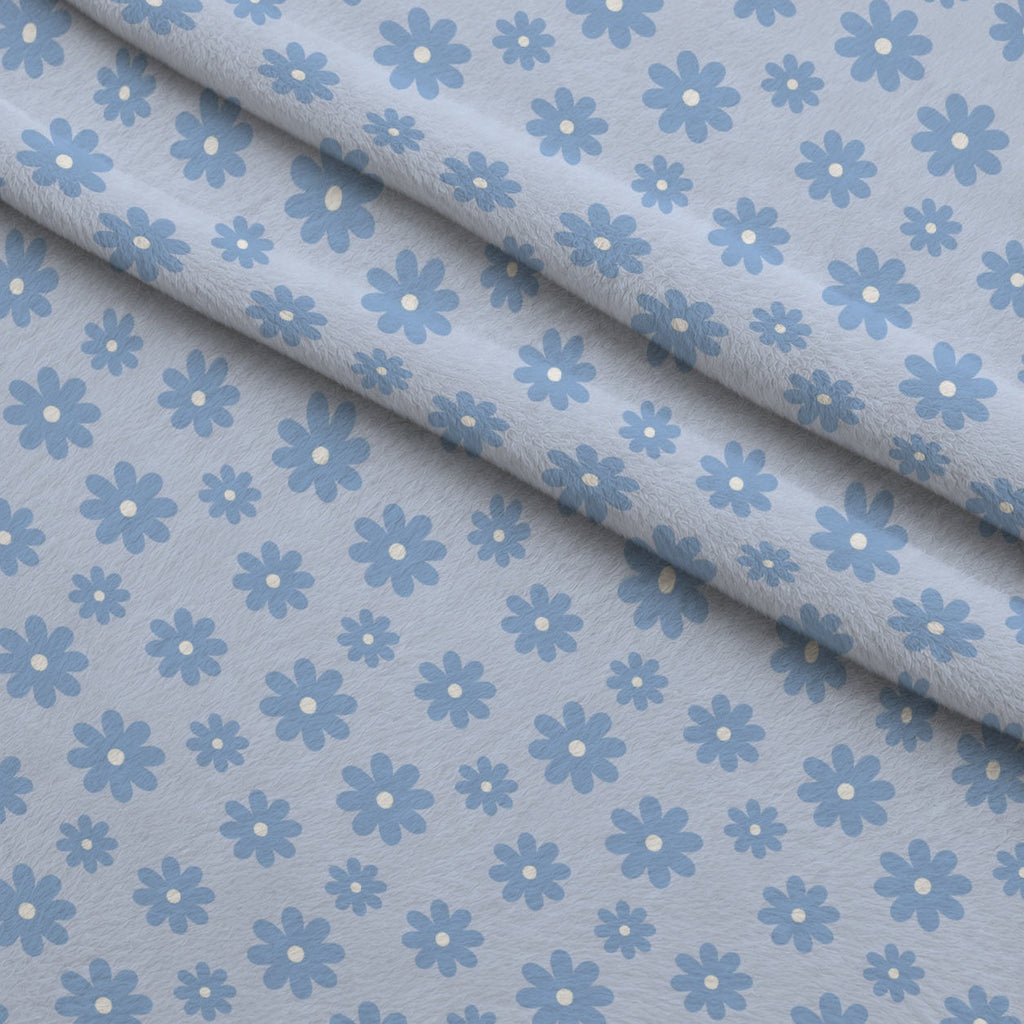 Periwinkle Dreams Daisies Fleece Fabric — fleece fabric folded close-up preview (mv-fleece-v1:lying)