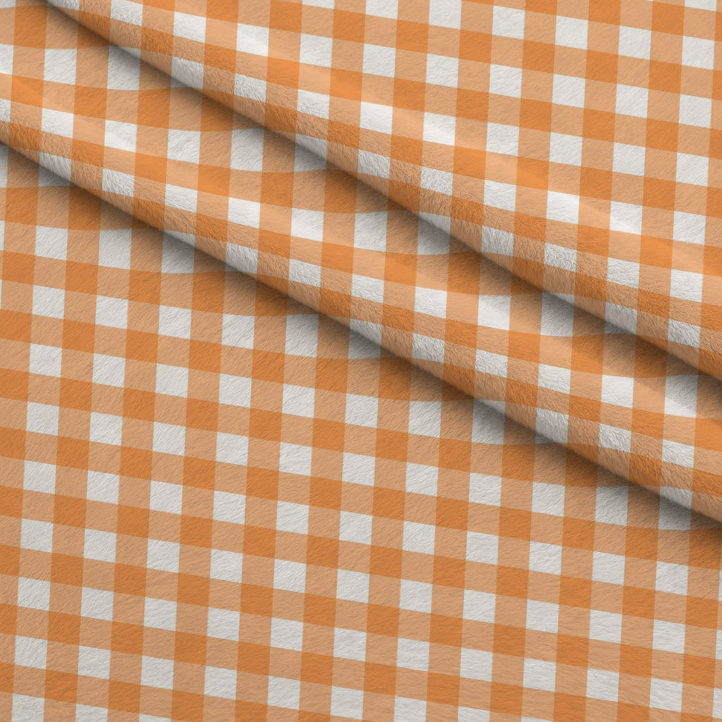 Pumpkin Gingham Pattern 6 Fleece Fabric — fleece fabric folded close-up preview (mv-fleece-v1:lying)