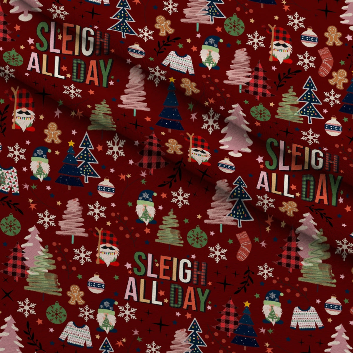 Sleigh All Day Dark Red Fleece Fabric — fleece fabric folded close-up preview (mv-fleece-v1:lying)