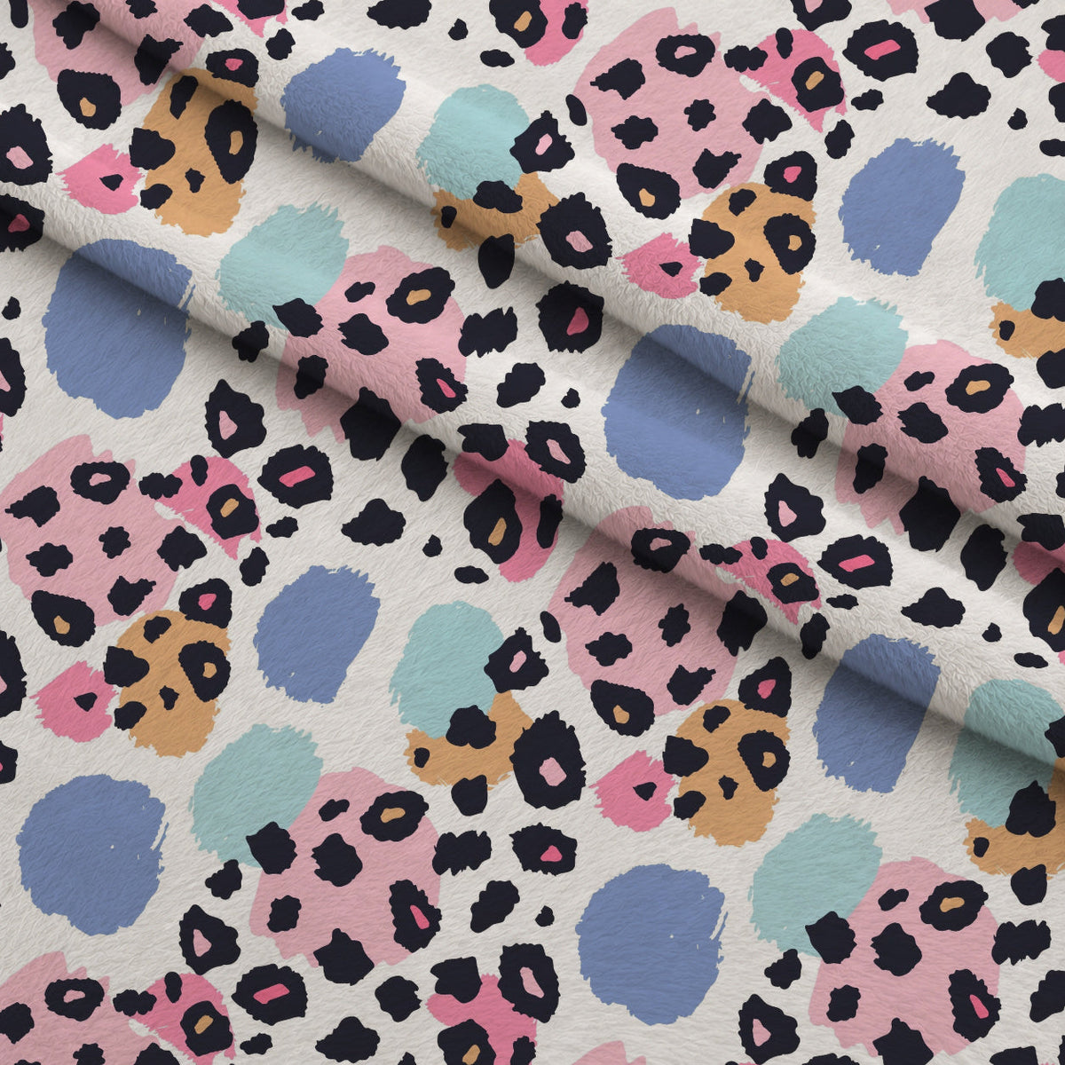 Sorbet Cheetah Spots Pattern 1 Fleece Fabric — fleece fabric folded close-up preview (mv-fleece-v1:lying)