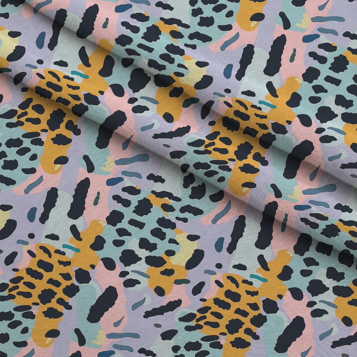 Sorbet Cheetah Spots Pattern 16 Fleece Fabric — fleece fabric folded close-up preview (mv-fleece-v1:lying)