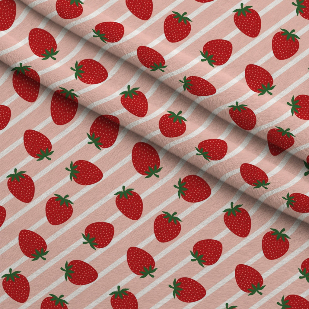 Sweet Strawberries Pink Diagonal Stripes Fleece Fabric — fleece fabric folded close-up preview (mv-fleece-v1:lying)