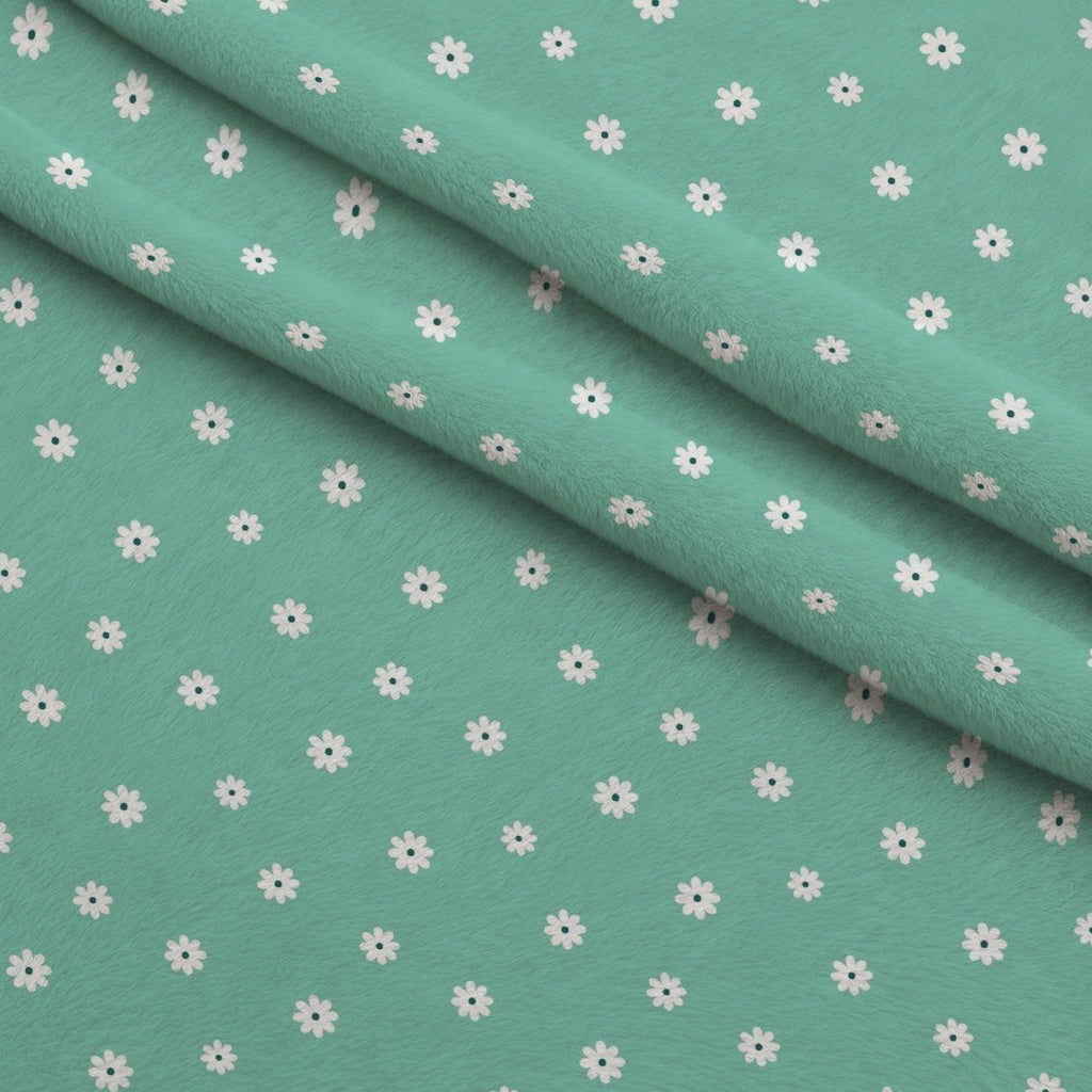 Tiny Daisies on Mint Fleece Fabric — fleece fabric folded close-up preview (mv-fleece-v1:lying)