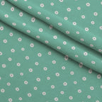Tiny Daisies on Mint Fleece Fabric — fleece fabric folded close-up preview (mv-fleece-v1:lying)