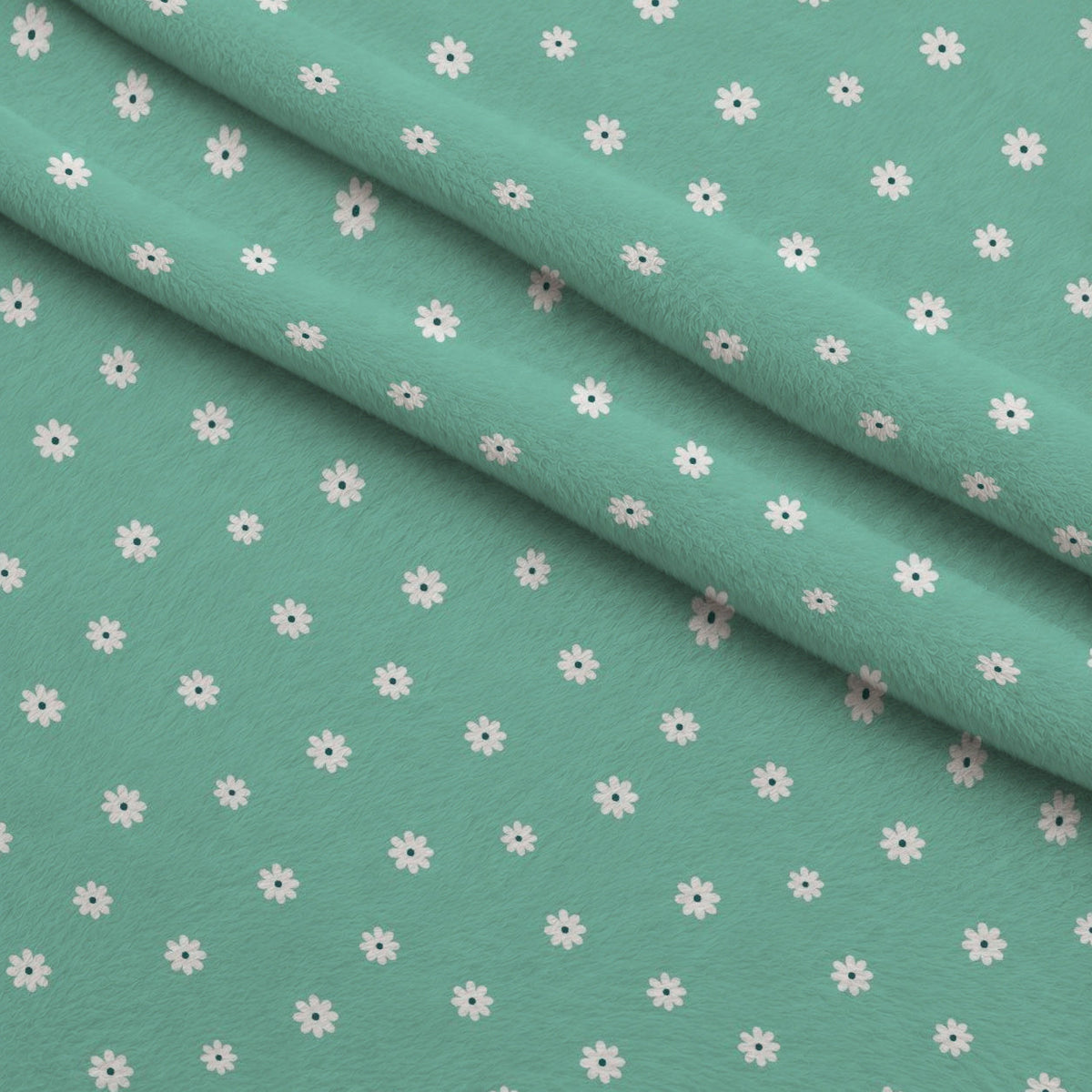 Tiny Daisies on Mint Fleece Fabric — fleece fabric folded close-up preview (mv-fleece-v1:lying)