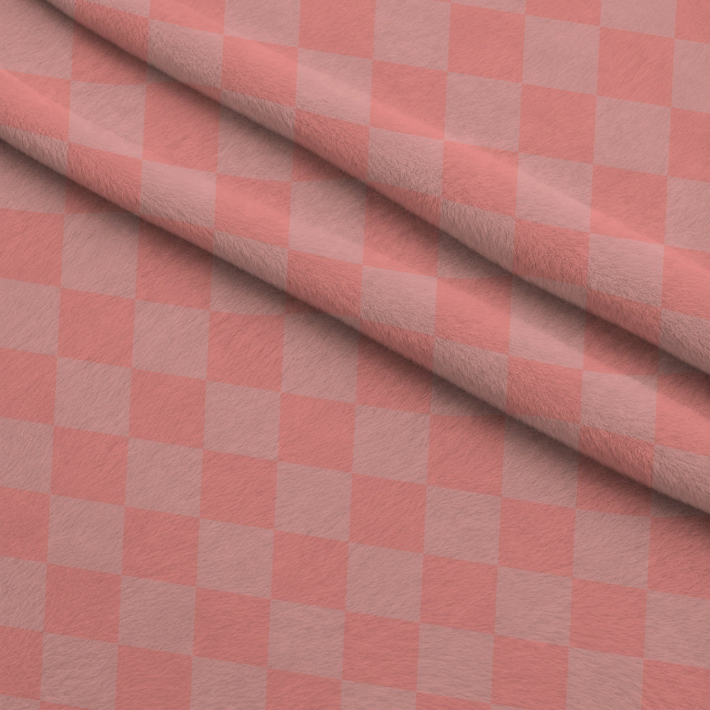 Two Tone Checkered Peach Puff Fleece Fabric — fleece fabric folded close-up preview (mv-fleece-v1:lying)