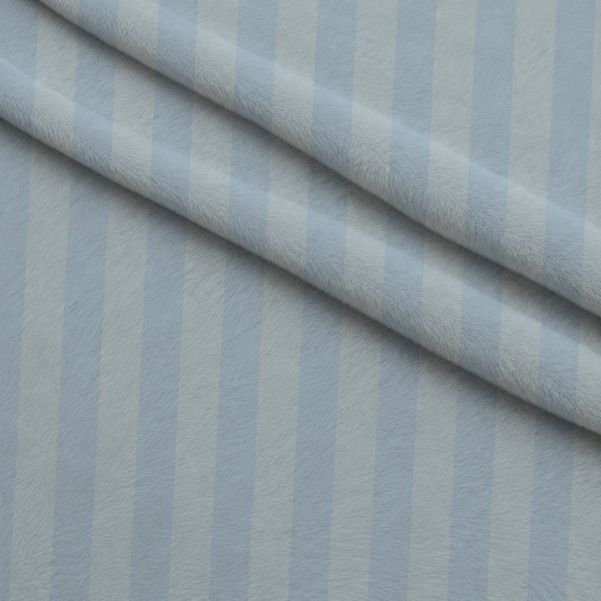 Two Tone Spindle Stripes Fleece Fabric — fleece fabric folded close-up preview (mv-fleece-v1:lying)