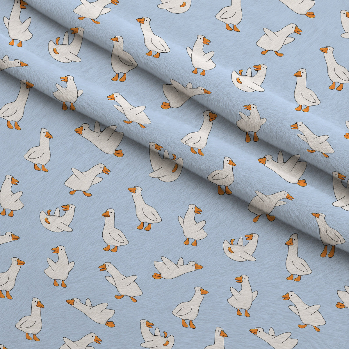 Waddle Squad Pattern 1 Fleece Fabric — fleece fabric folded close-up preview (mv-fleece-v1:lying)